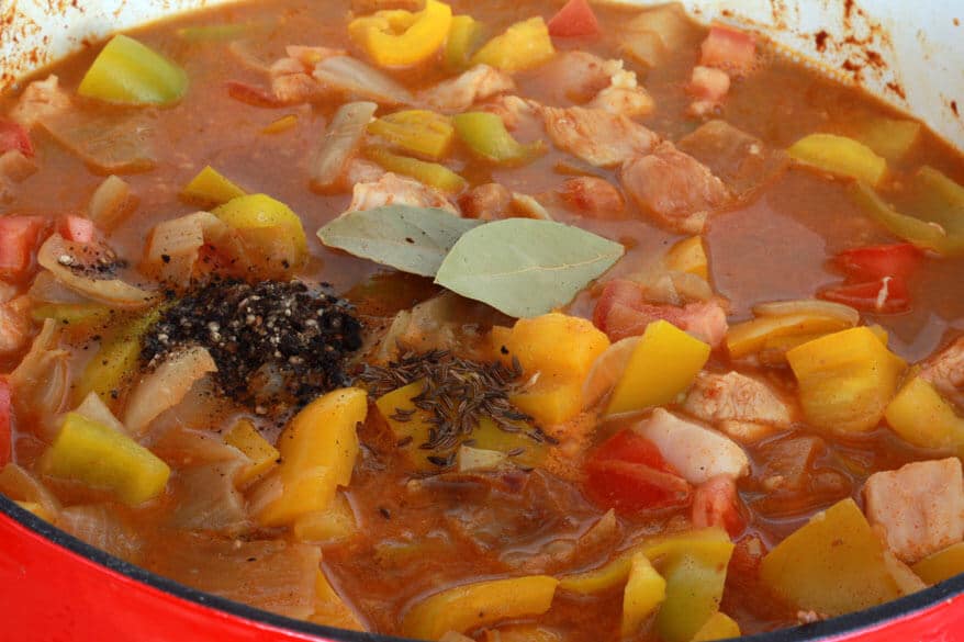 adding spices to the pot