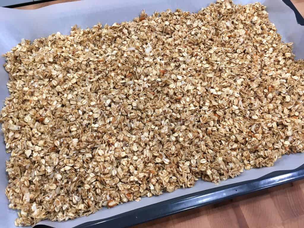 spreading mixture out onto baking sheet