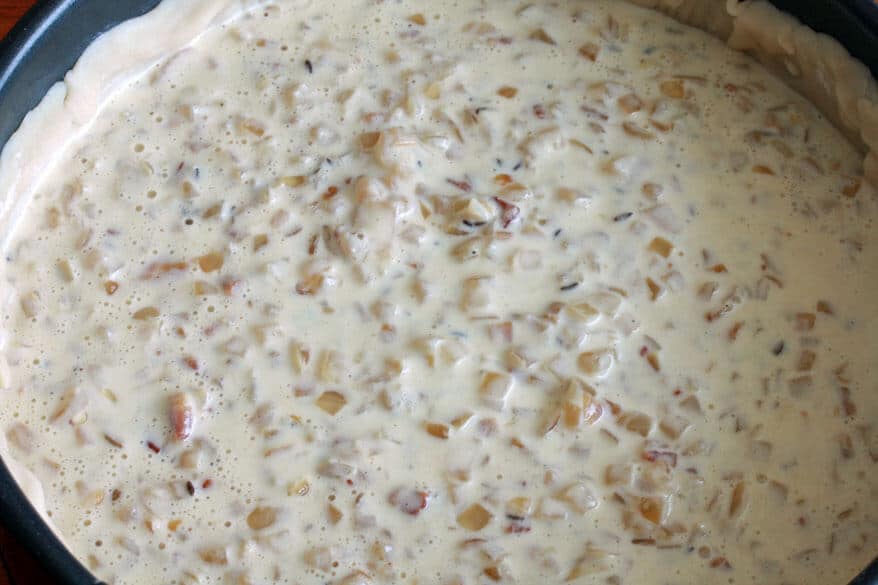 pouring filling into pastry crust