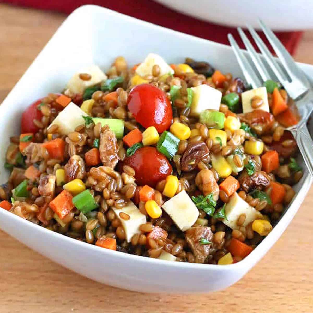 Mexican Wheat Berry Salad recipe chipotles corn tomatoes cheese walnuts raisins carrots onions vinaigrette