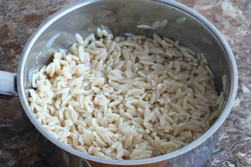 cooked orzo in a saucepan
