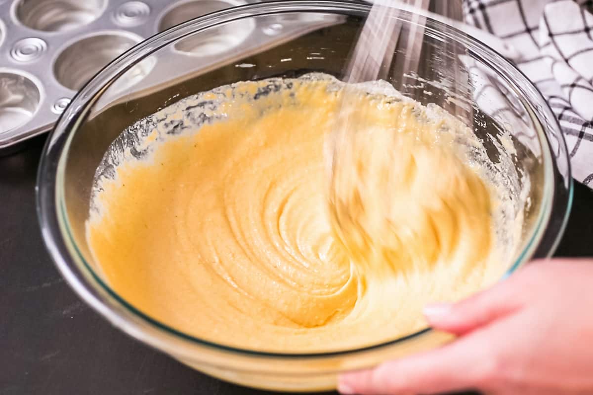 mixing batter in glass bowl