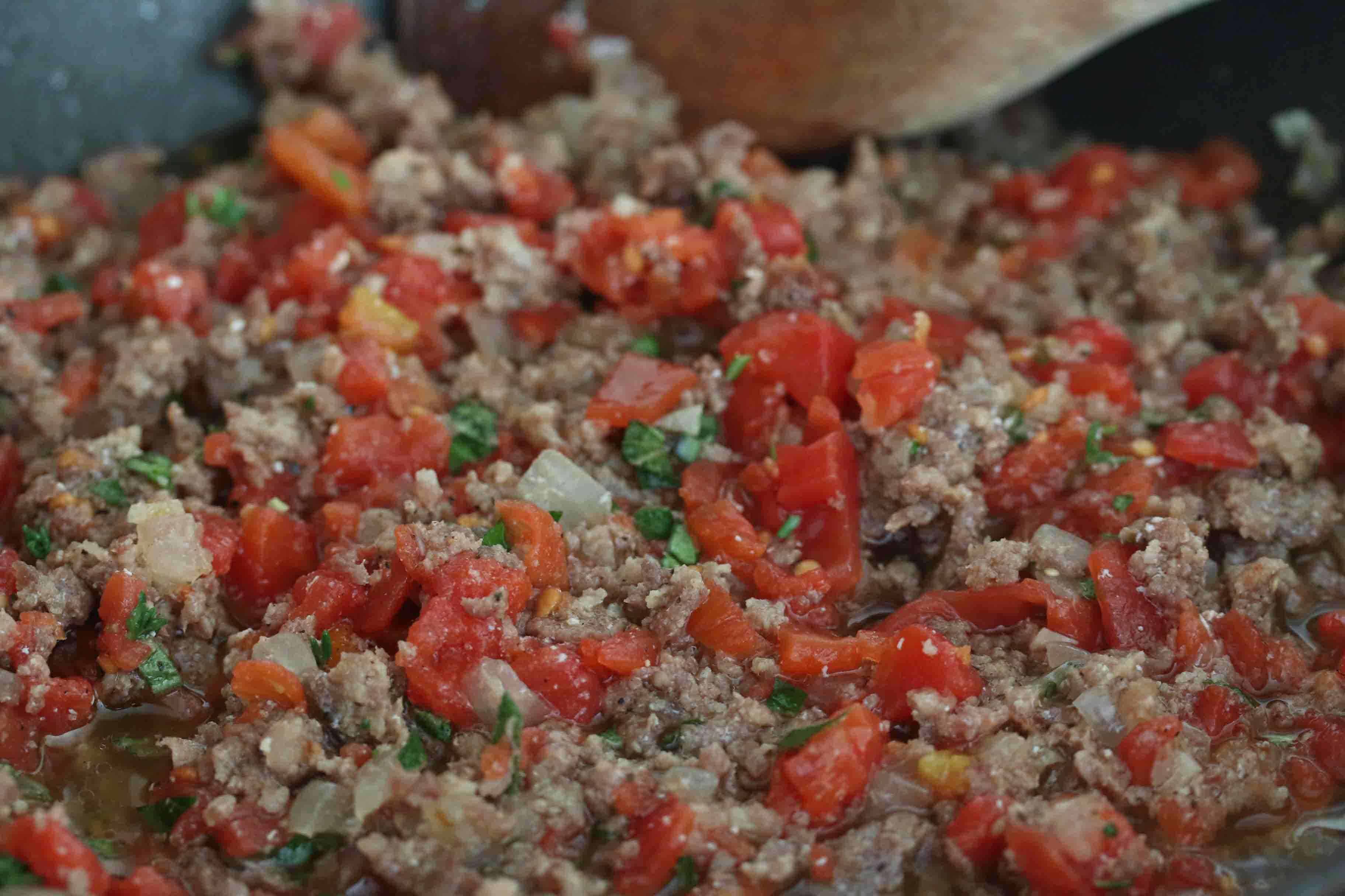 cooking sausage and tomato mixture