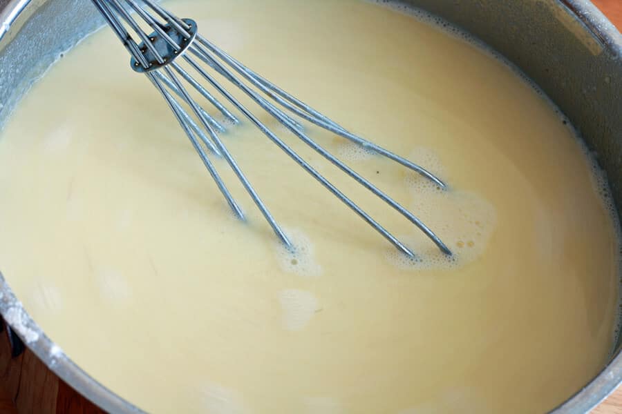 stirring ingredients in saucepan