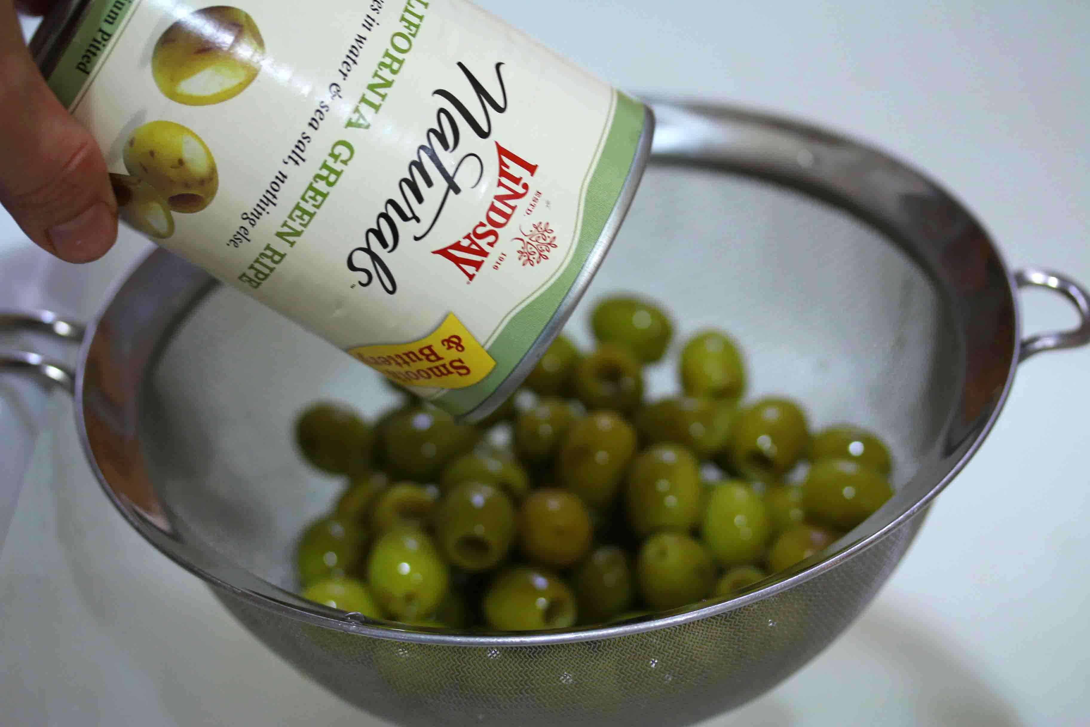 pouring olives from can