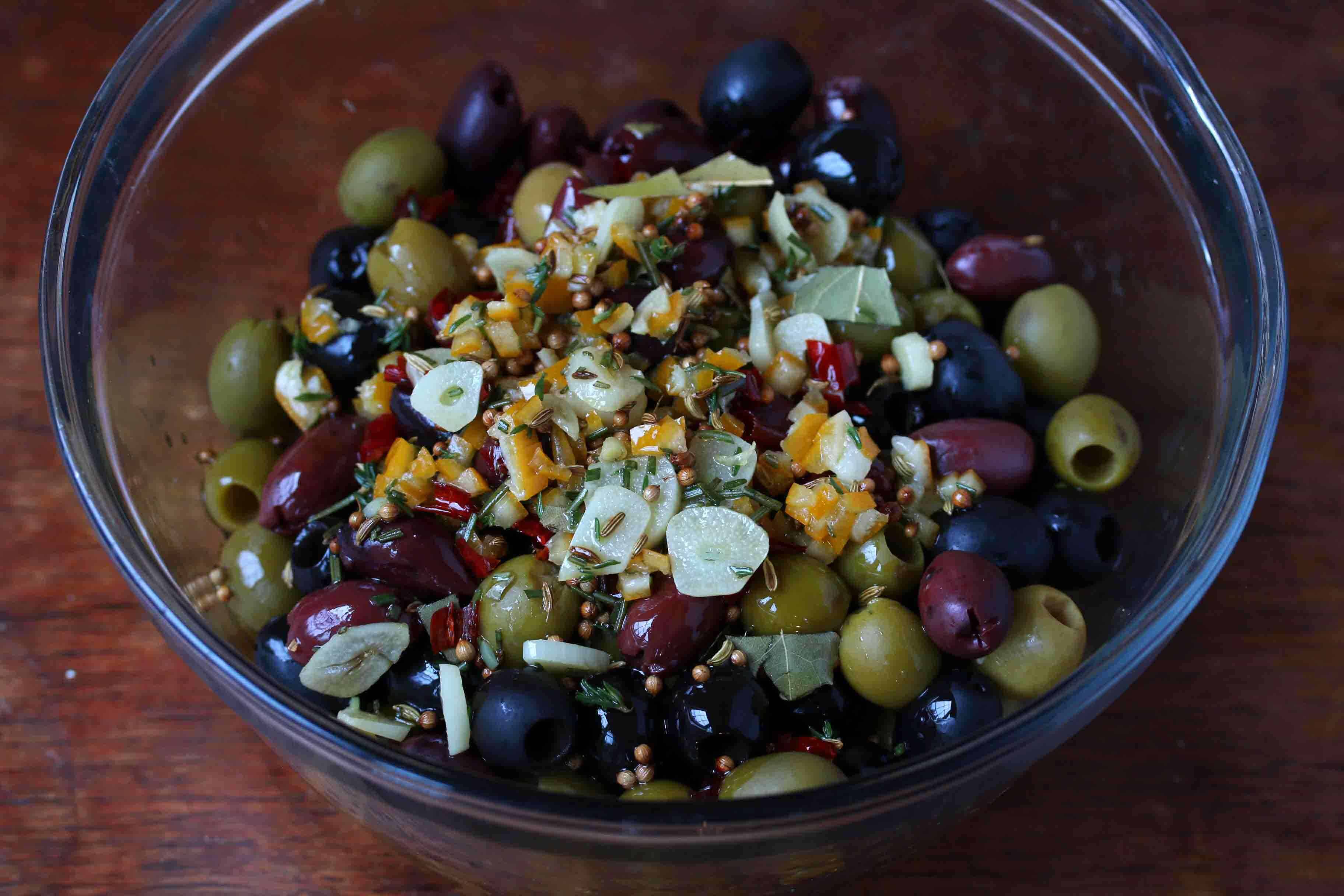 stir marinade and olives together