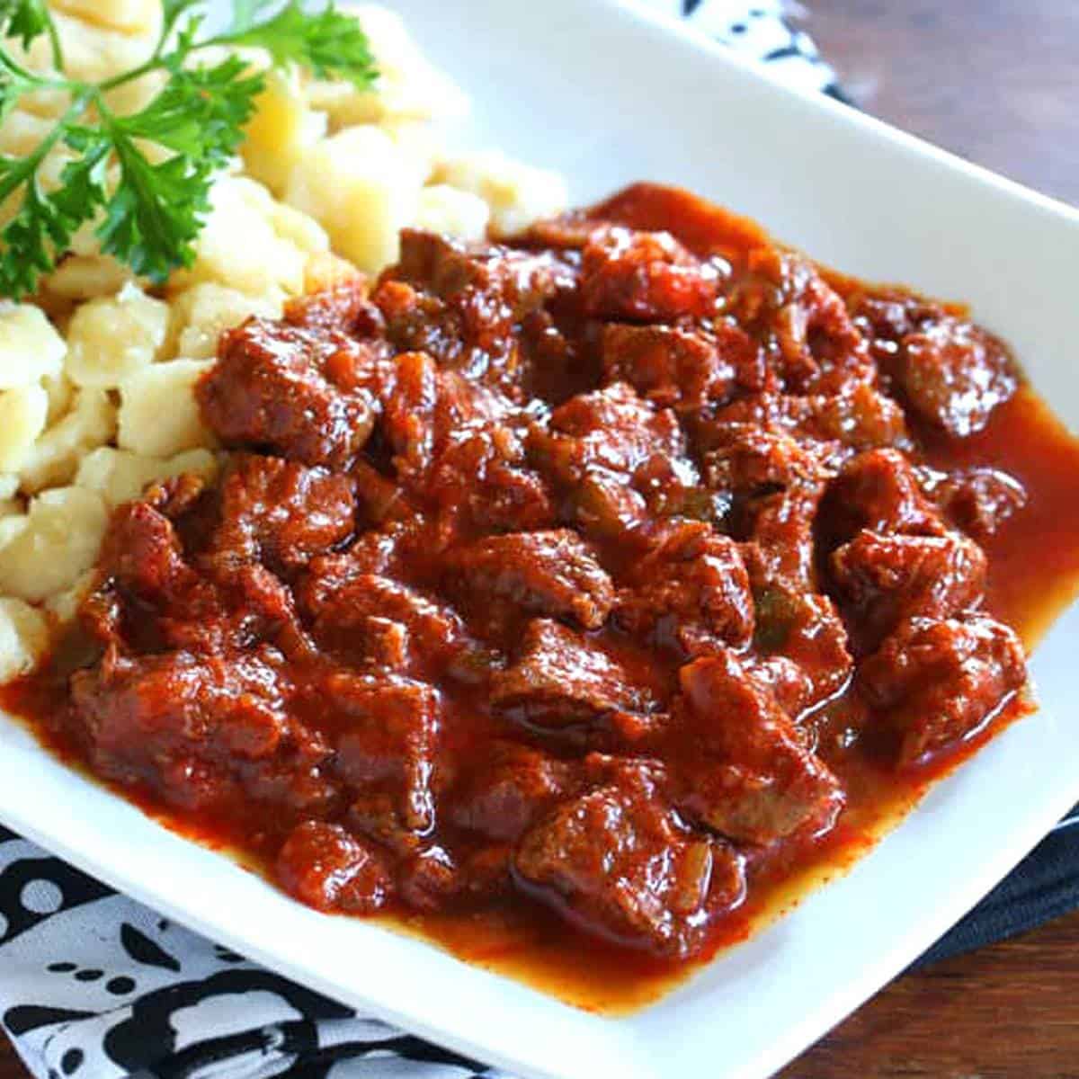 Authentic Pörkölt (Hungarian Beef and Onion Stew) - The Daring Gourmet