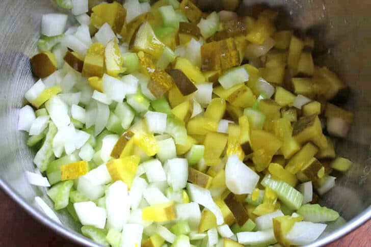 combining the pickles onions and celery