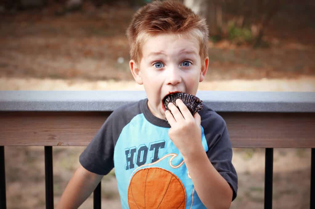 boy eating cupcake