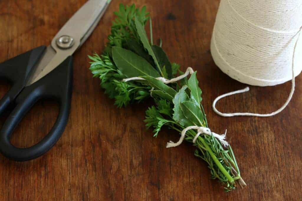 The bouquet garni is a bundle of herbs usually tied together with string  and mainly used to prepare soup, stock, casseroles and various stews. The  bouquet is cooked with the other ingredients