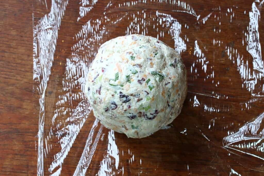 forming the mixture into a ball and wrapping in plastic wrap