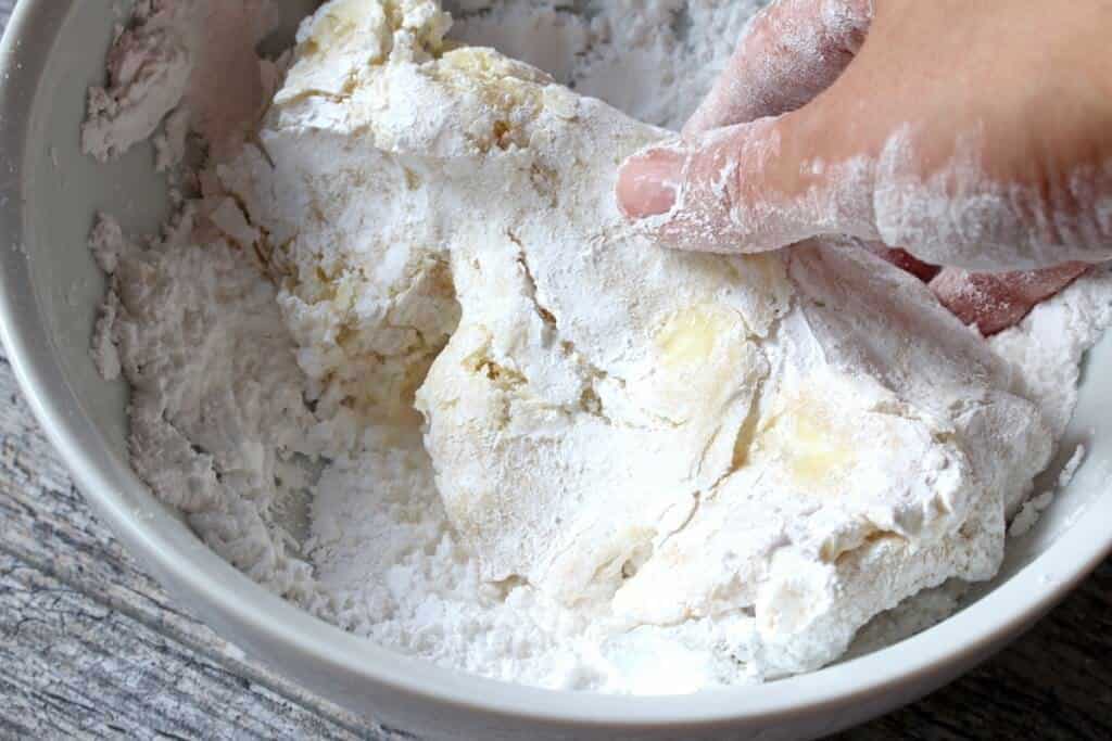 kneading the ingredients together