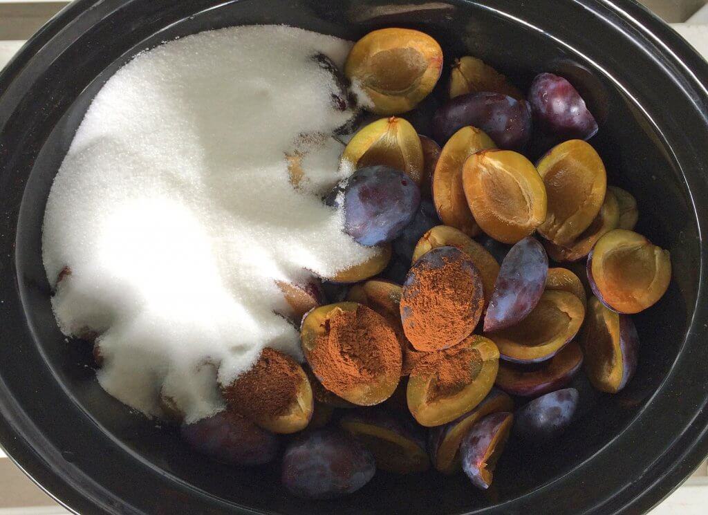 adding sugar and spices to slow cooker