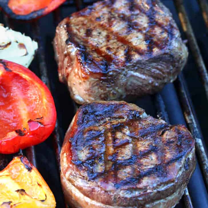grilled steaks on grill