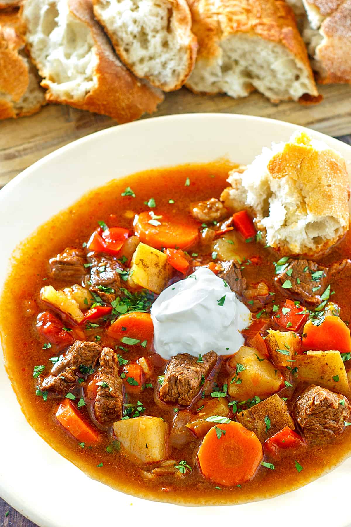 hungarian goulash recipe traditional authentic gulyas beef stew paprika carrots peppers potatoes sour cream caraway