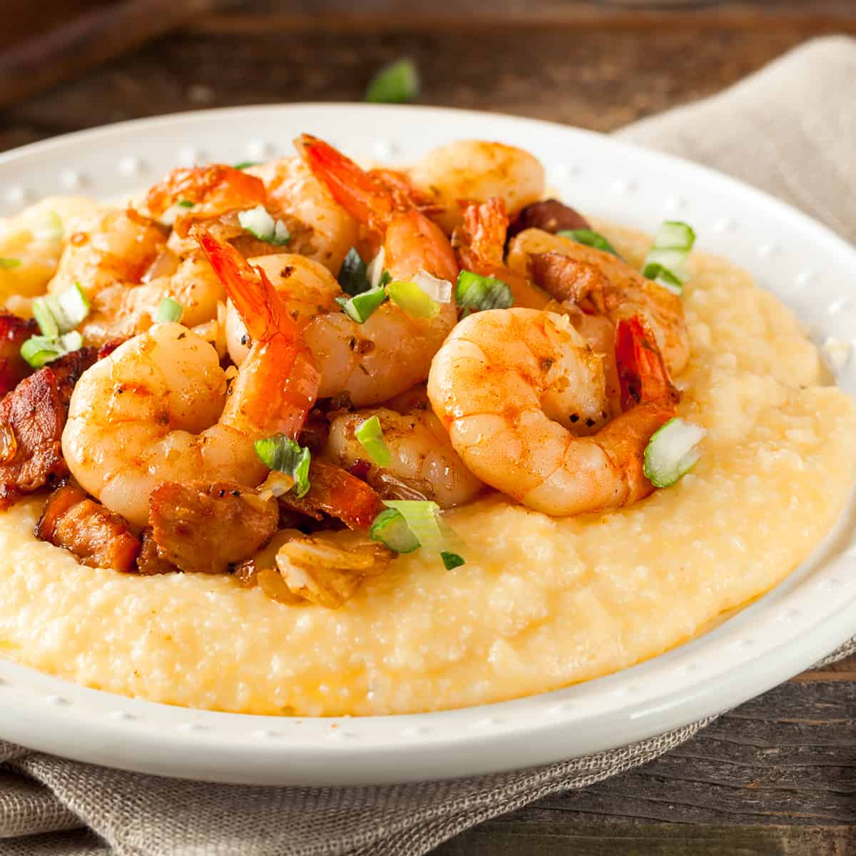 shrimp and grits recipe traditional southern andouille sausage bacon peppers onions cajun creole seasoning creamy cheese