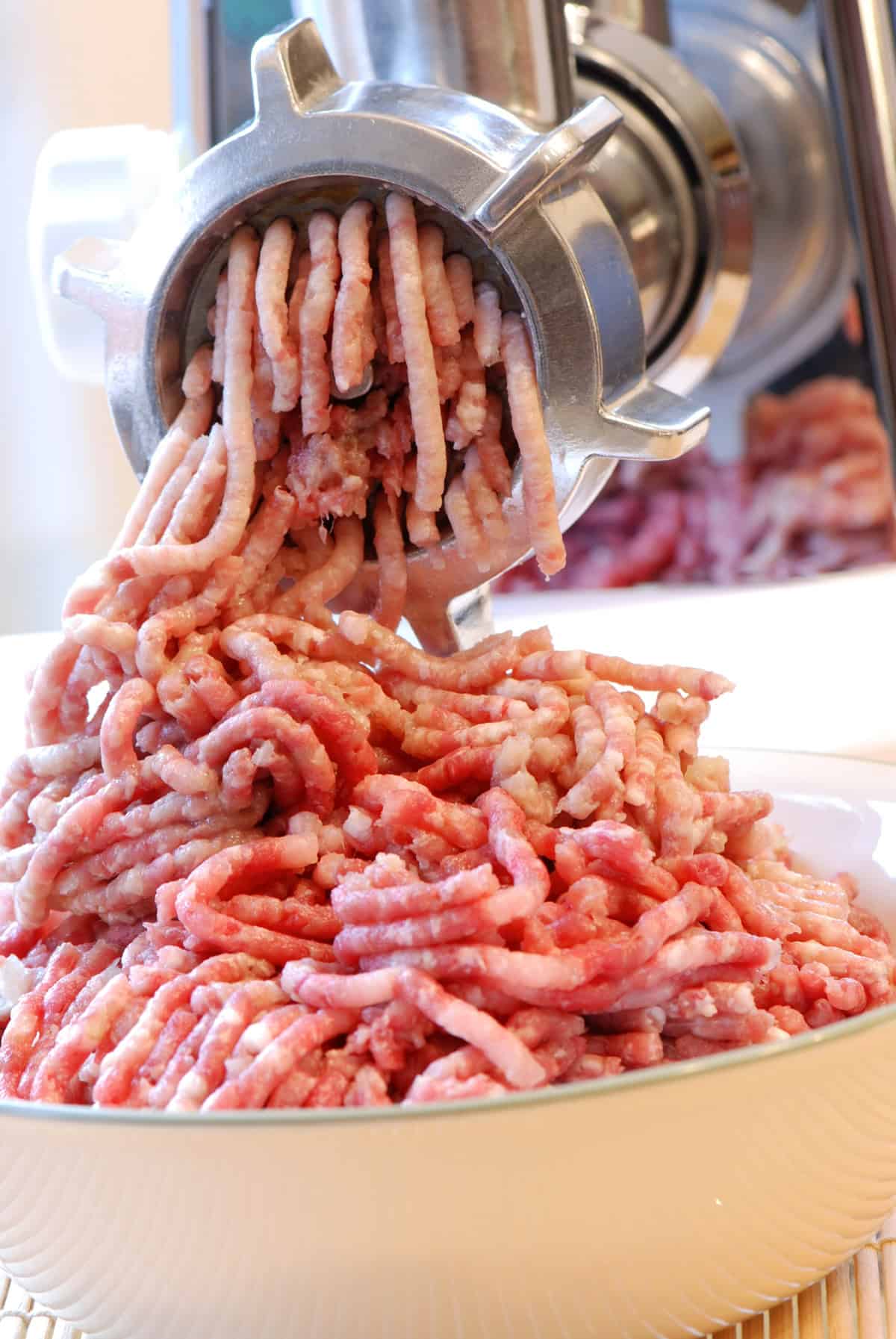 grinding fresh pork for sausage
