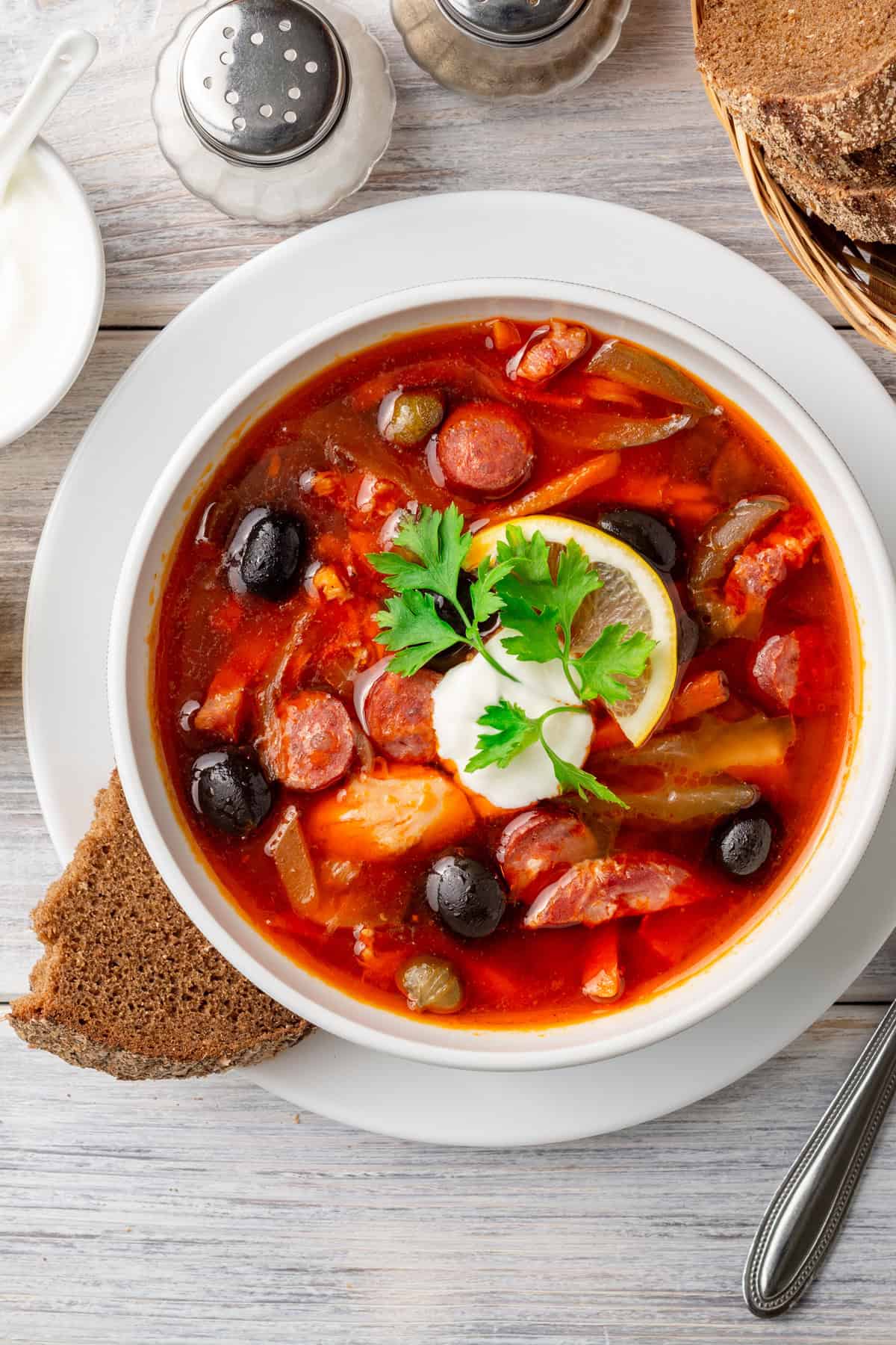 solyanka recipe best traditional authentic russian ukrainian sour soup east german soljanka rezept smoked meat sausage cabbage pickles olives capers