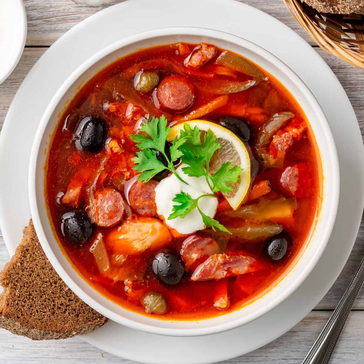 solyanka recipe best traditional authentic russian ukrainian sour soup east german soljanka rezept smoked meat sausage cabbage pickles olives capers