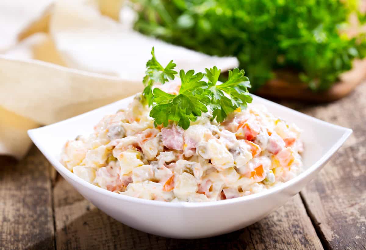 olivier salad recipe russian potato authentic traditional old fashioned olivye ham cucumbers peas peppers capers eggs