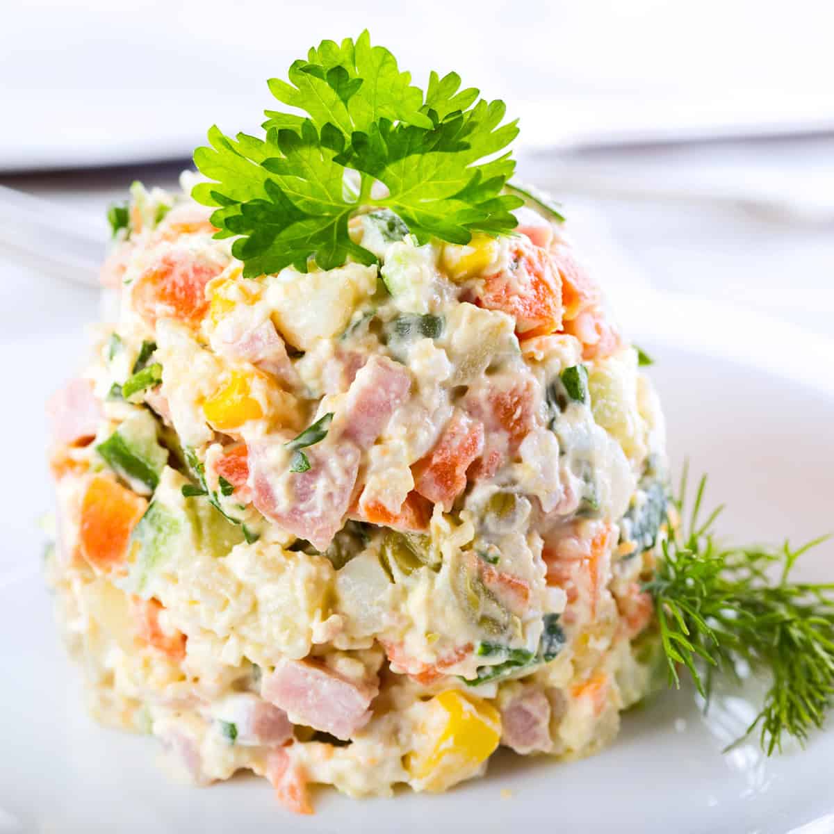 olivier salad recipe russian potato authentic traditional old fashioned olivye ham cucumbers peas peppers capers eggs