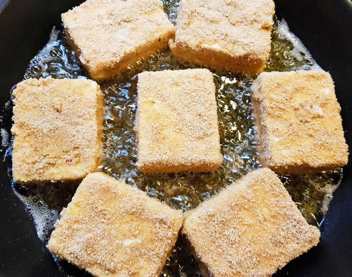 frying the coated cheese in oil in non stick pan