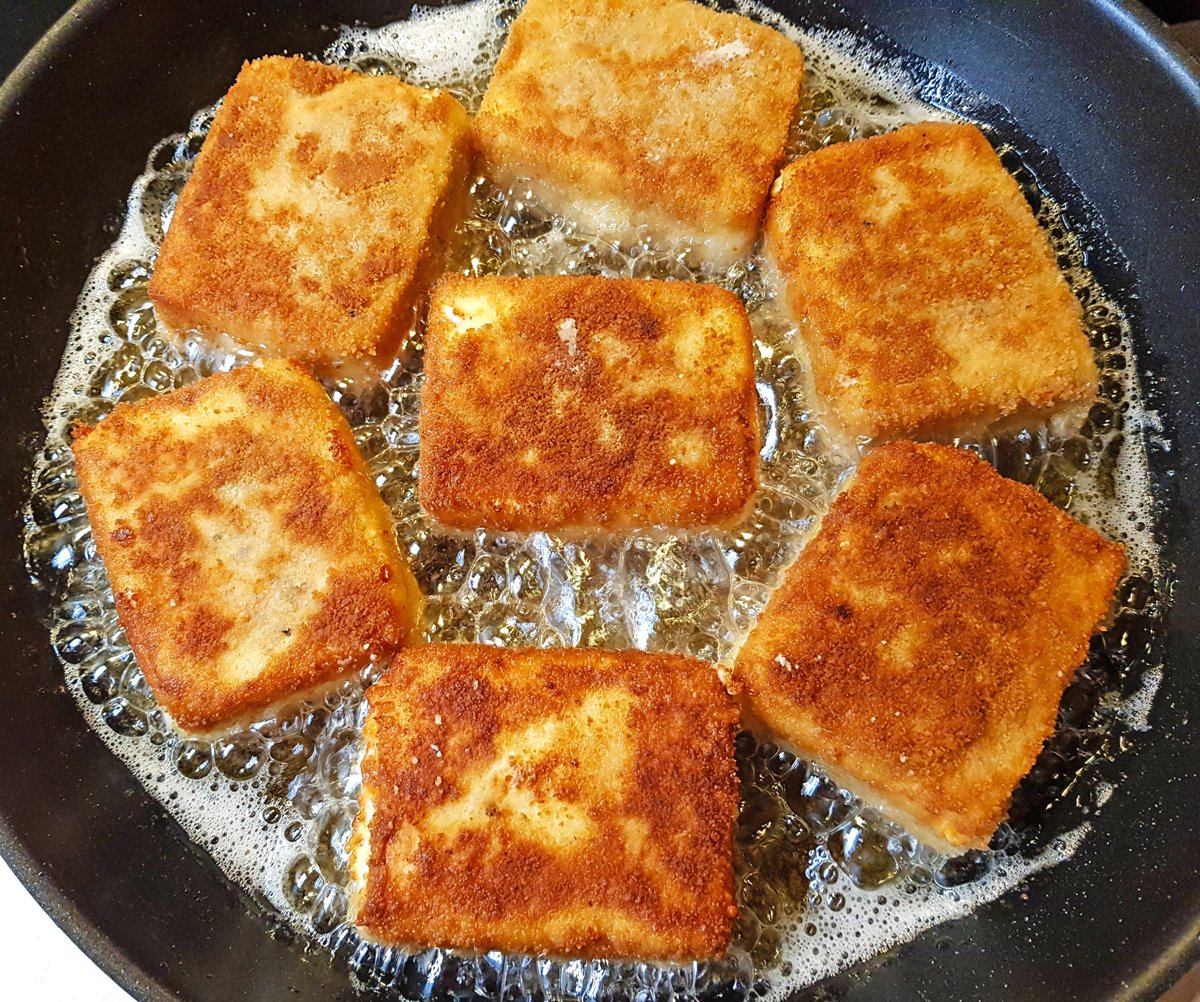 frying the cheese until golden brown