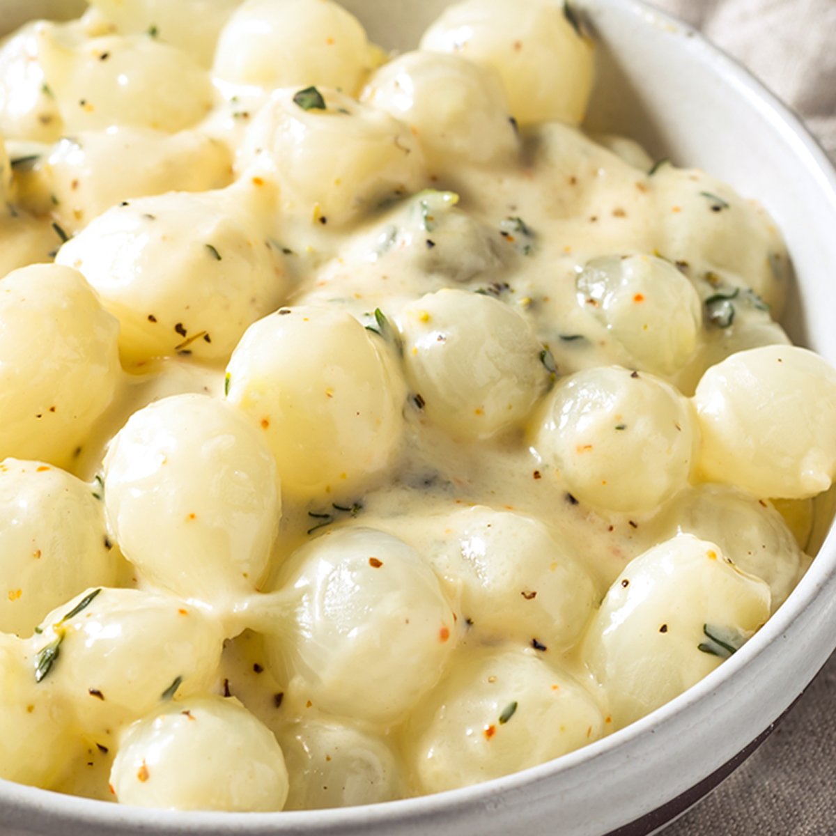 creamed onions recipe pearl white heavy cream herbs thyme sage cheese easy best elegant gourmet